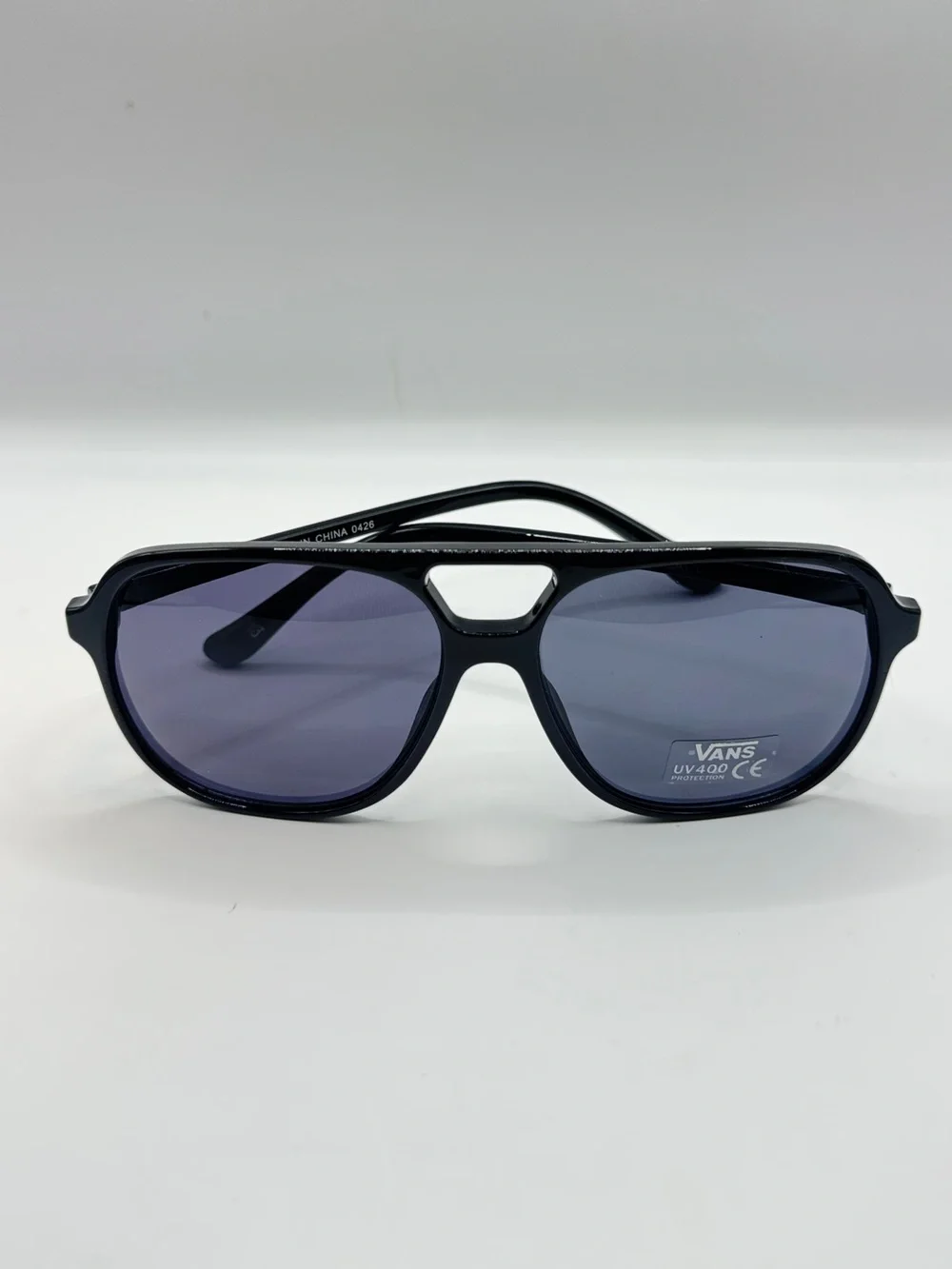 Vans Glossy Black Sunglasses with Blue-Tinted Lenses